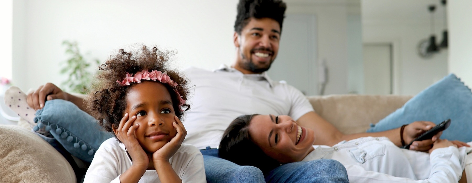 a family relaxing on a couch